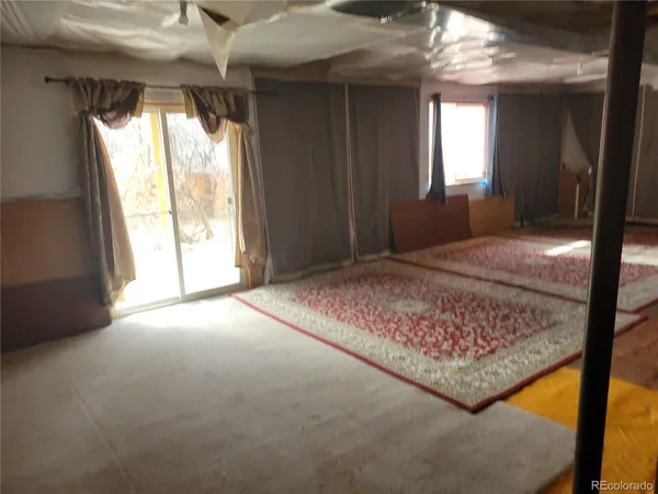 a view of livingroom with window and hardwood floor