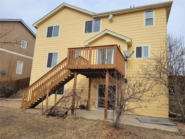 a view of a house with wooden stairs