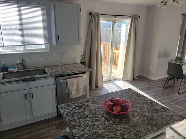 a kitchen with a sink and a window