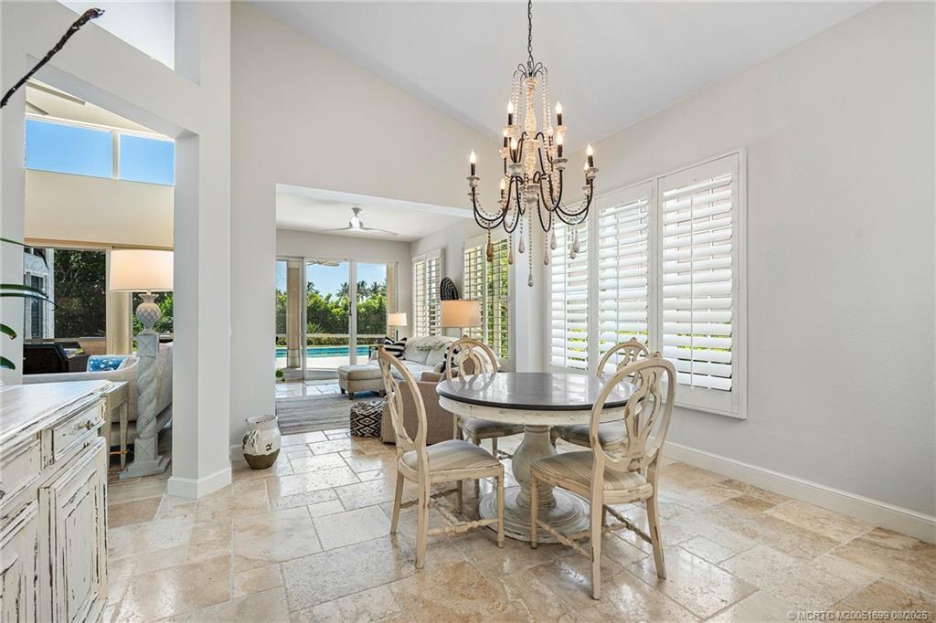 7000 Southeast Lakeview Terrace Stuart, FL 34996 - Photo 15 of 56 a view of a dining room with furniture window and outside view