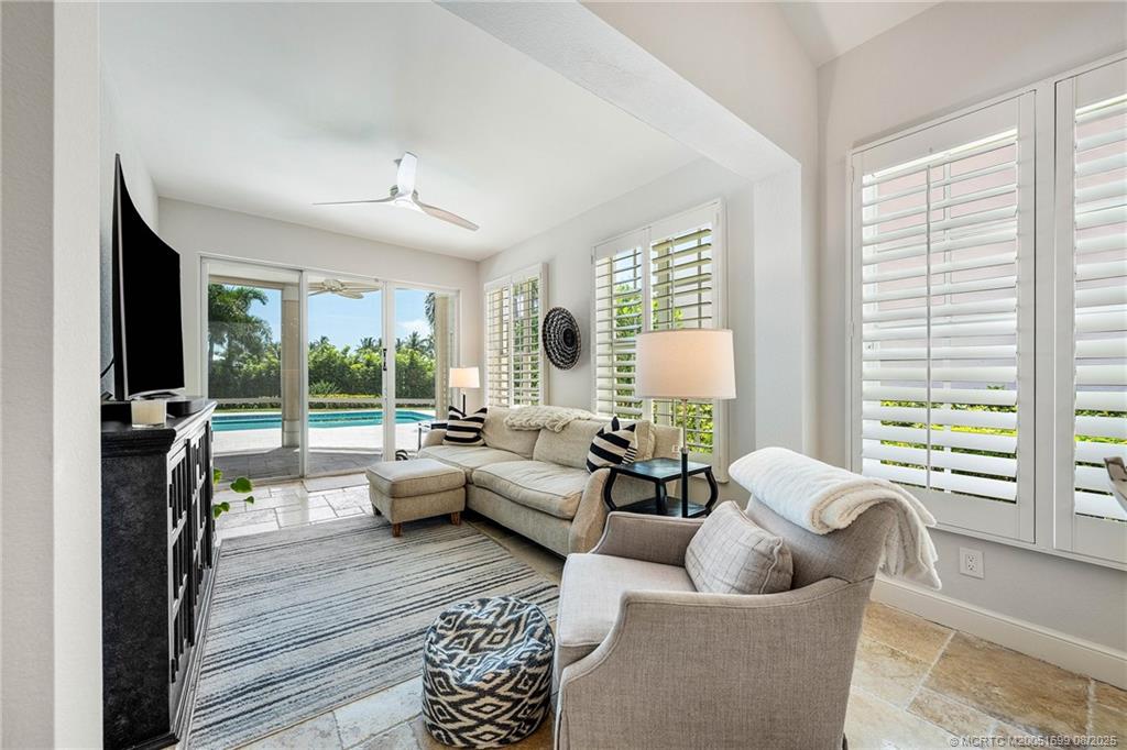 7000 Southeast Lakeview Terrace Stuart, FL 34996 - Photo 16 of 56 a living room with furniture and a large window