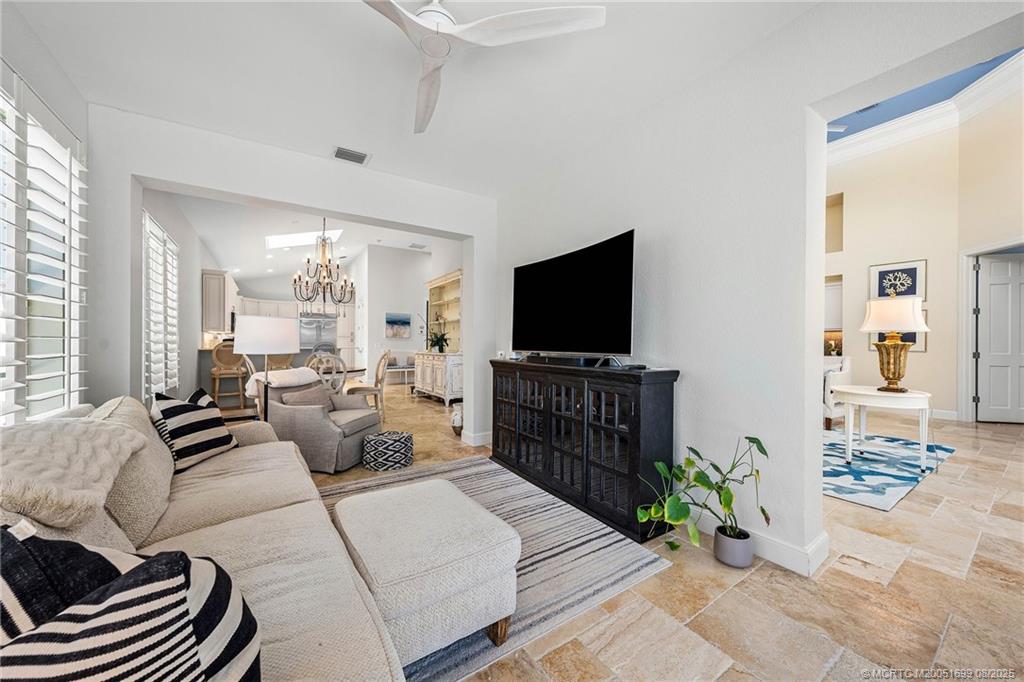 7000 Southeast Lakeview Terrace Stuart, FL 34996 - Photo 17 of 56 a living room with furniture and a flat screen tv