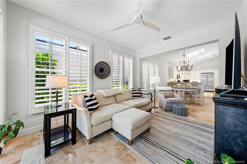 7000 Southeast Lakeview Terrace Stuart, FL 34996 - Photo 18 of 56 a living room with furniture and a large window