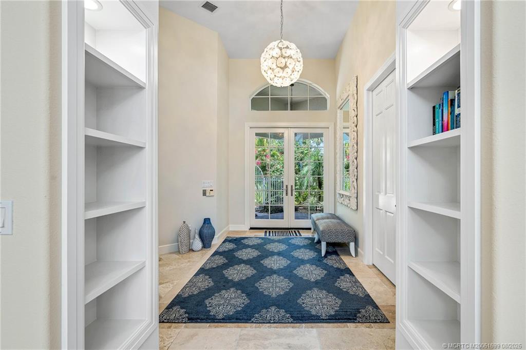 7000 Southeast Lakeview Terrace Stuart, FL 34996 - Photo 20 of 56 a living room with furniture and a large window