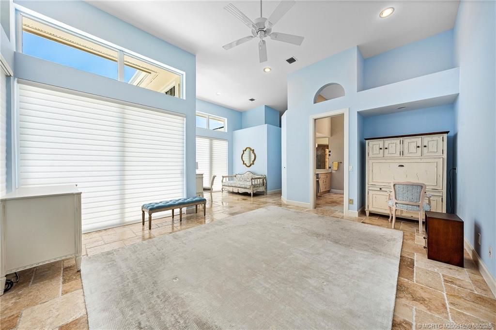 7000 Southeast Lakeview Terrace Stuart, FL 34996 - Photo 26 of 56 a bedroom with furniture and a window