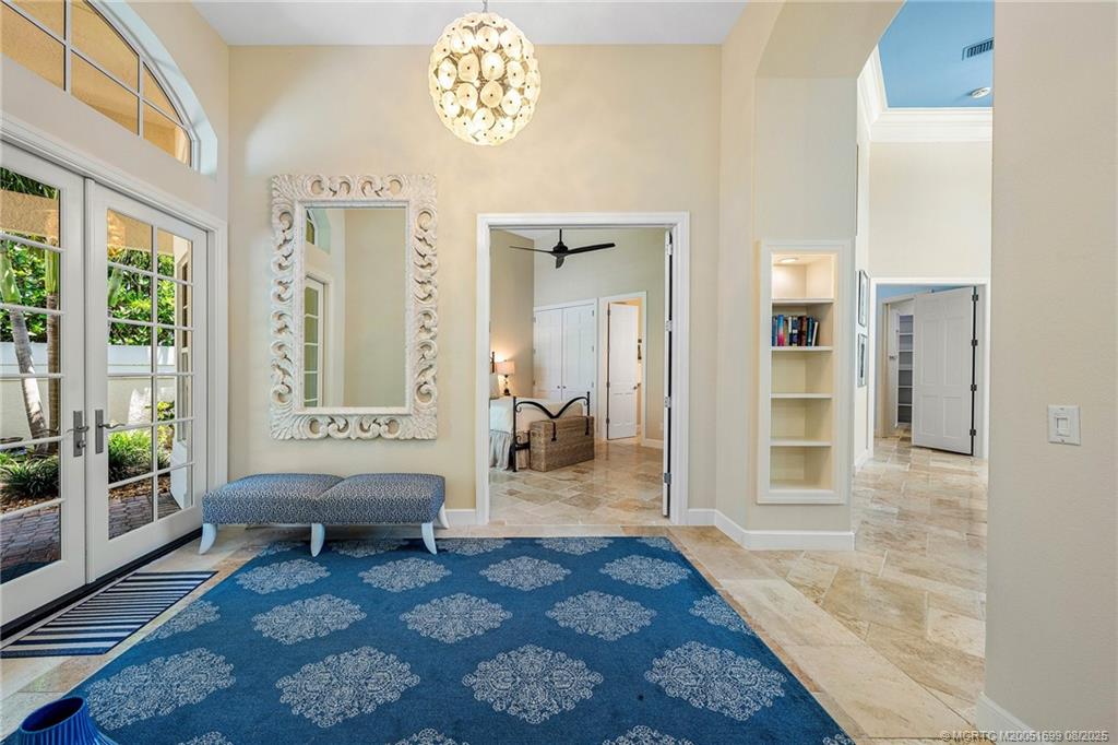 7000 Southeast Lakeview Terrace Stuart, FL 34996 - Photo 30 of 56 a living room with furniture and a rug