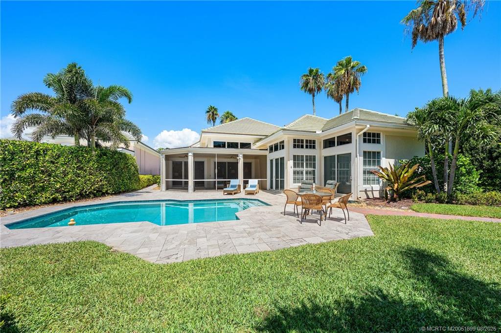 7000 Southeast Lakeview Terrace Stuart, FL 34996 - Photo 3 of 56 a view of a house with a backyard and swimming pool
