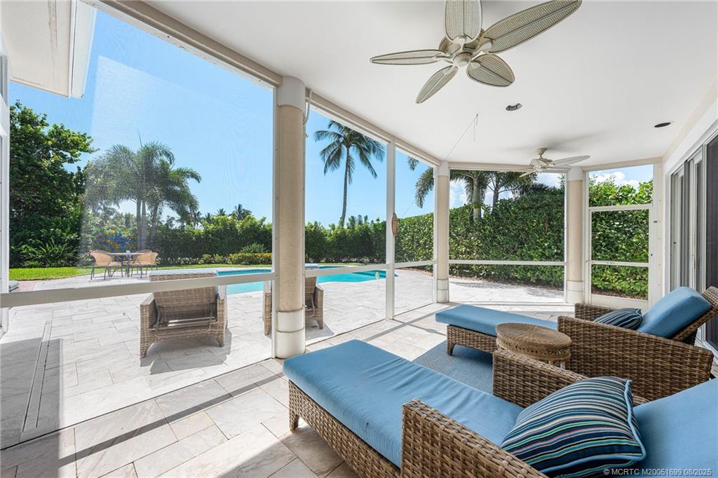 7000 Southeast Lakeview Terrace Stuart, FL 34996 - Photo 35 of 56 a living room with furniture and a large window