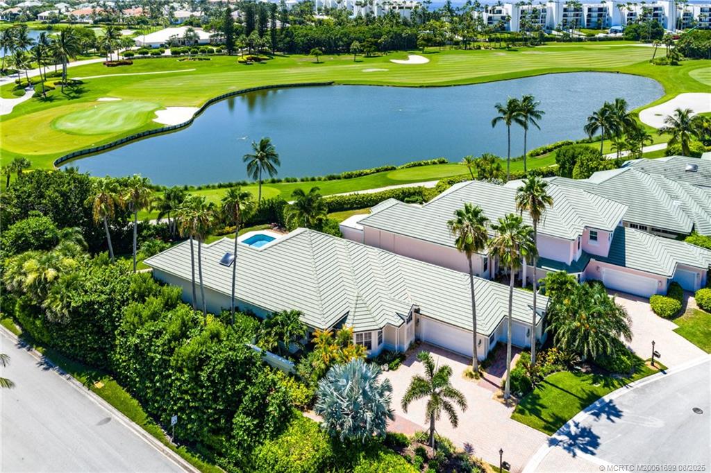 7000 Southeast Lakeview Terrace Stuart, FL 34996 - Photo 50 of 56 an aerial view of a house with a garden and lake view