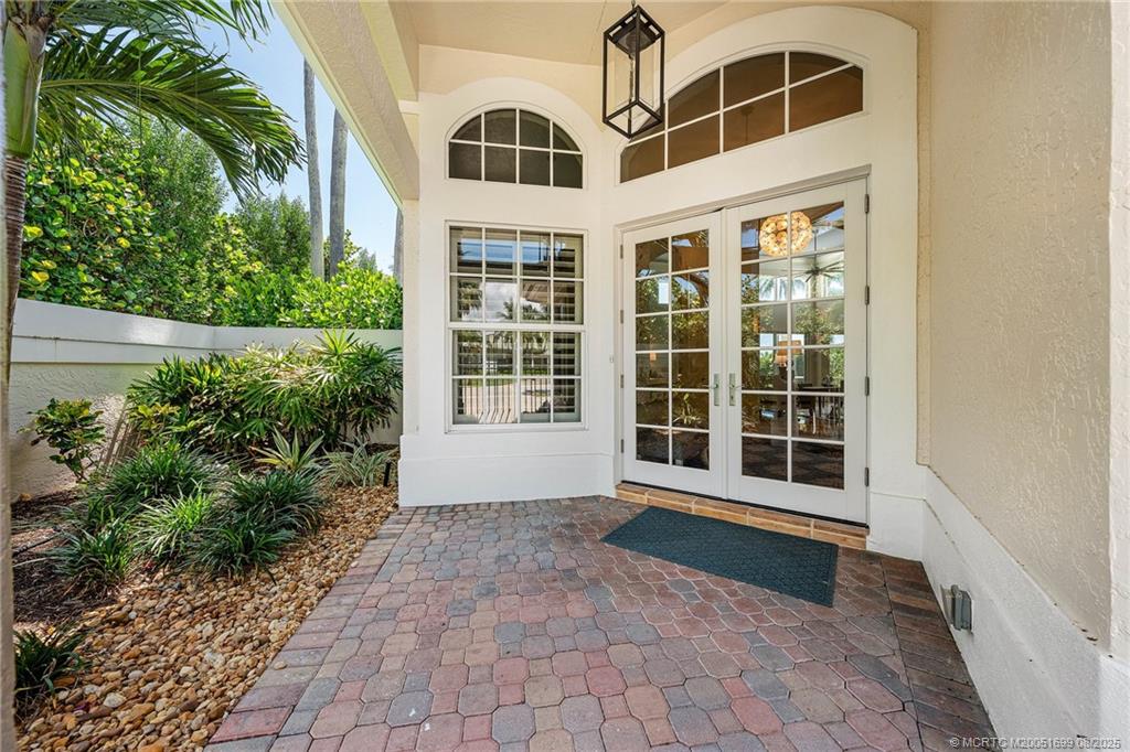 7000 Southeast Lakeview Terrace Stuart, FL 34996 - Photo 56 of 56 a view of front door and potted plants
