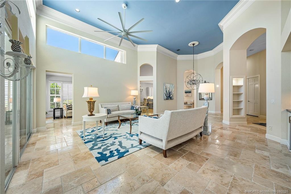 7000 Southeast Lakeview Terrace Stuart, FL 34996 - Photo 6 of 56 a living room with furniture and a chandelier