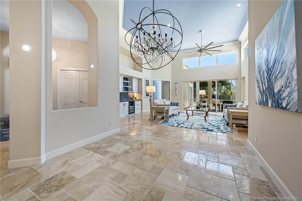7000 Southeast Lakeview Terrace Stuart, FL 34996 - Photo 9 of 56 a view of dining hall with couches and large windows