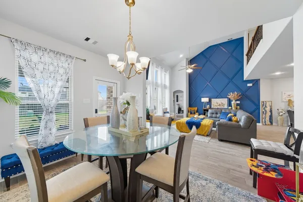 a view of a dining room with furniture and wooden floor