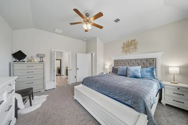 a bedroom with a bed and furniture