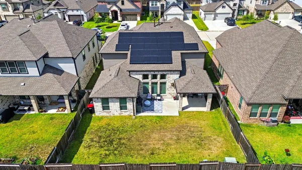 a aerial view of a house with swimming pool