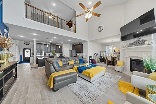 a living room with furniture fireplace and a flat screen tv