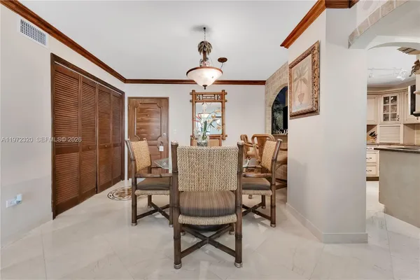 a dining room with furniture and window
