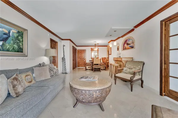 a living room with furniture and a painting