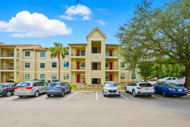 a view of cars parked in front of a building