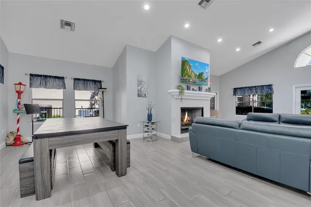 a living room with furniture and a fireplace