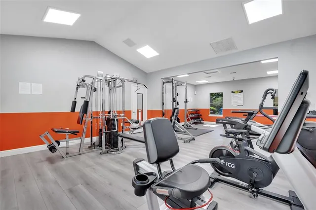 a room with furniture and gym equipment