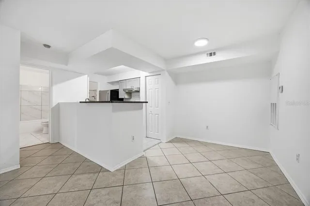 a view of a kitchen with electric appliances