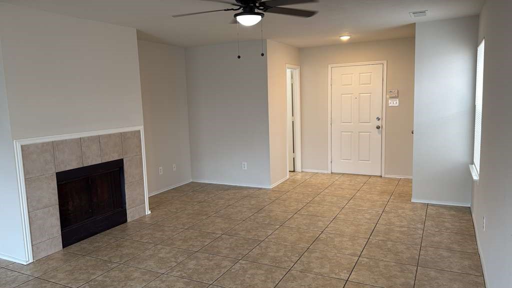 6622 Sutton Meadows Drive Houston, TX 77086 - Photo 18 of 45 a view of an empty room with a fireplace