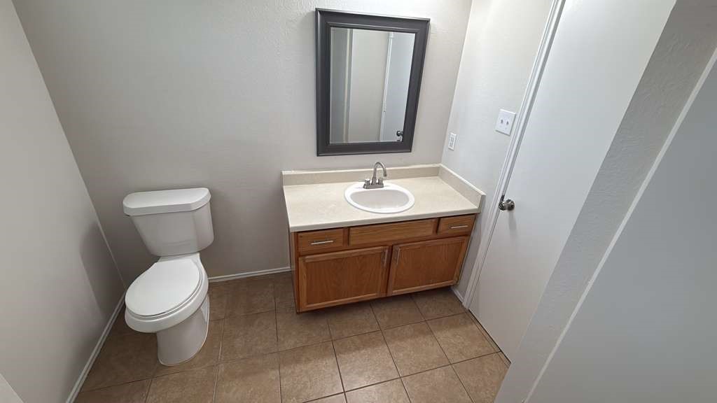 6622 Sutton Meadows Drive Houston, TX 77086 - Photo 29 of 45 a bathroom with a toilet sink and mirror