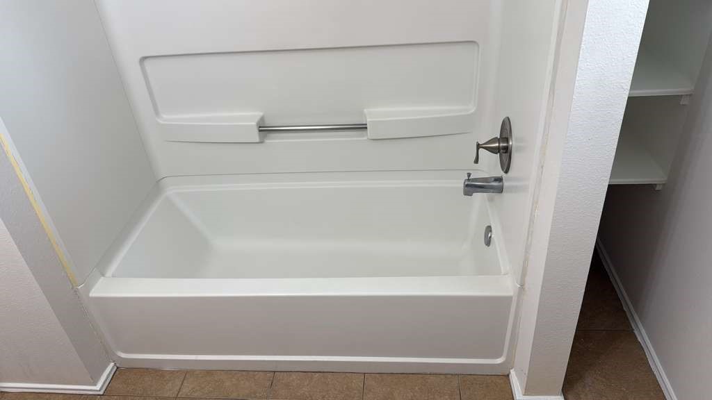 6622 Sutton Meadows Drive Houston, TX 77086 - Photo 31 of 45 a close up of a bathtub in a bathroom