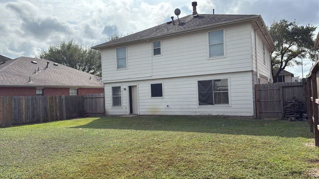 6622 Sutton Meadows Drive Houston, TX 77086 - Photo 45 of 45 a front view of a house with a yard and garage
