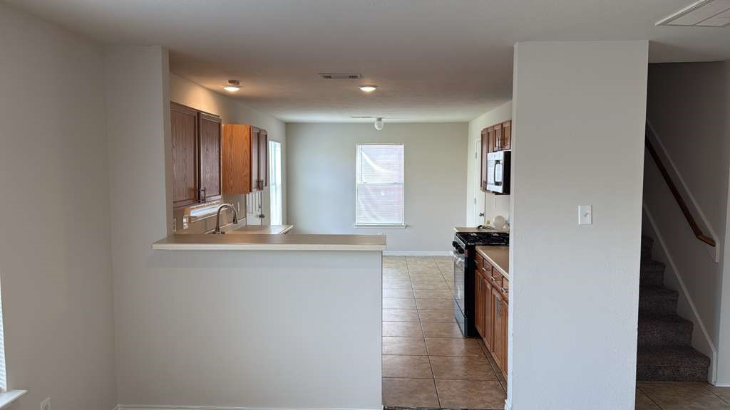 6622 Sutton Meadows Drive Houston, TX 77086 - Photo 6 of 45 a view of hallway with furniture and a window