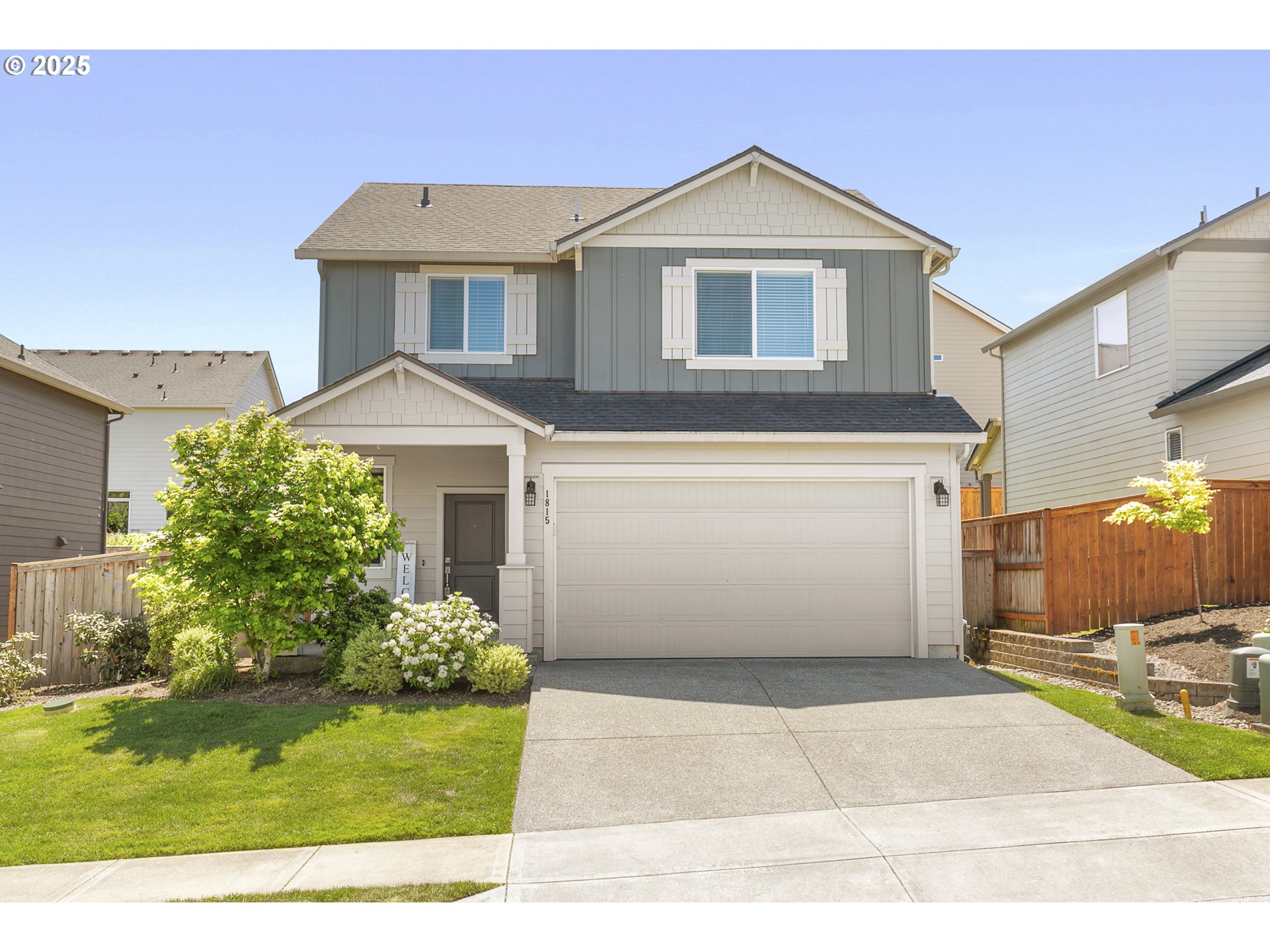 1815 Northeast 172nd Street Ridgefield, WA 98642 - Photo 1 of 19 a front view of a house with a yard