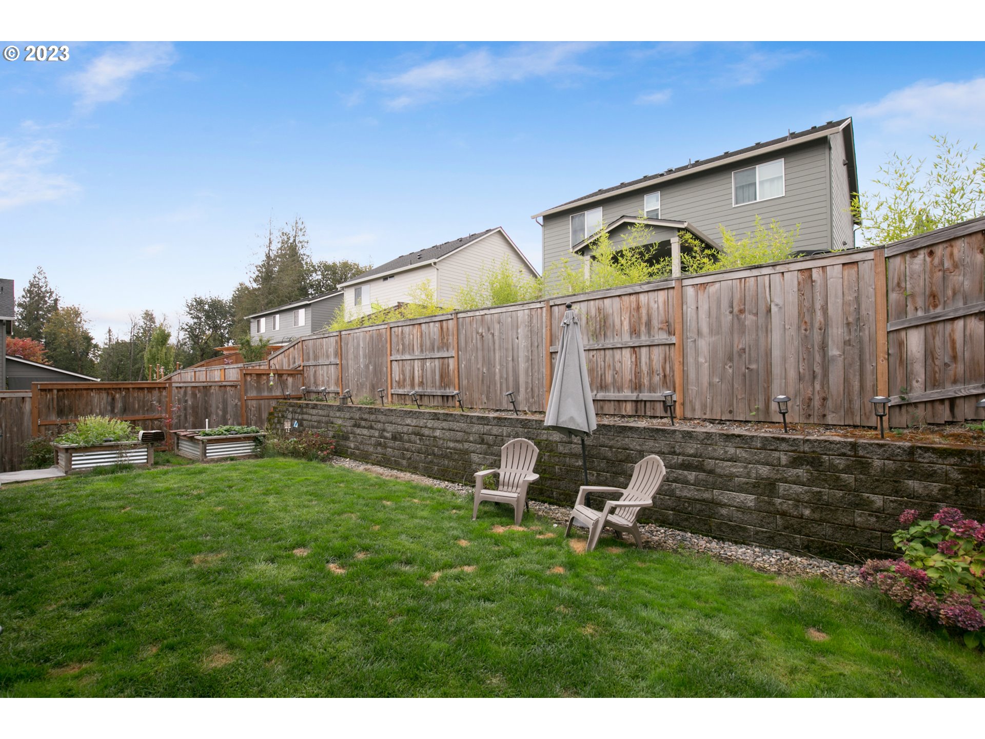 1815 Northeast 172nd Street Ridgefield, WA 98642 - Photo 15 of 19 a backyard of a house with table and chairs