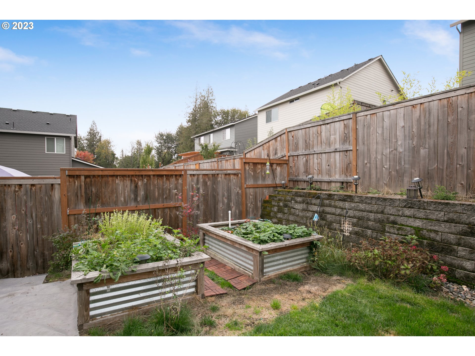 1815 Northeast 172nd Street Ridgefield, WA 98642 - Photo 16 of 19 a backyard of a house with fountain table and chairs