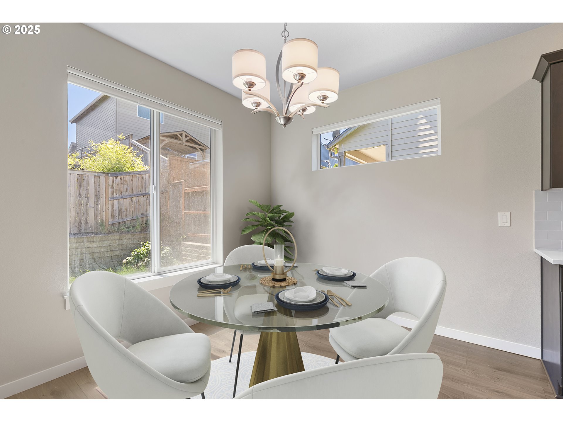 1815 Northeast 172nd Street Ridgefield, WA 98642 - Photo 5 of 19 a dining room with furniture a large window and a chandelier