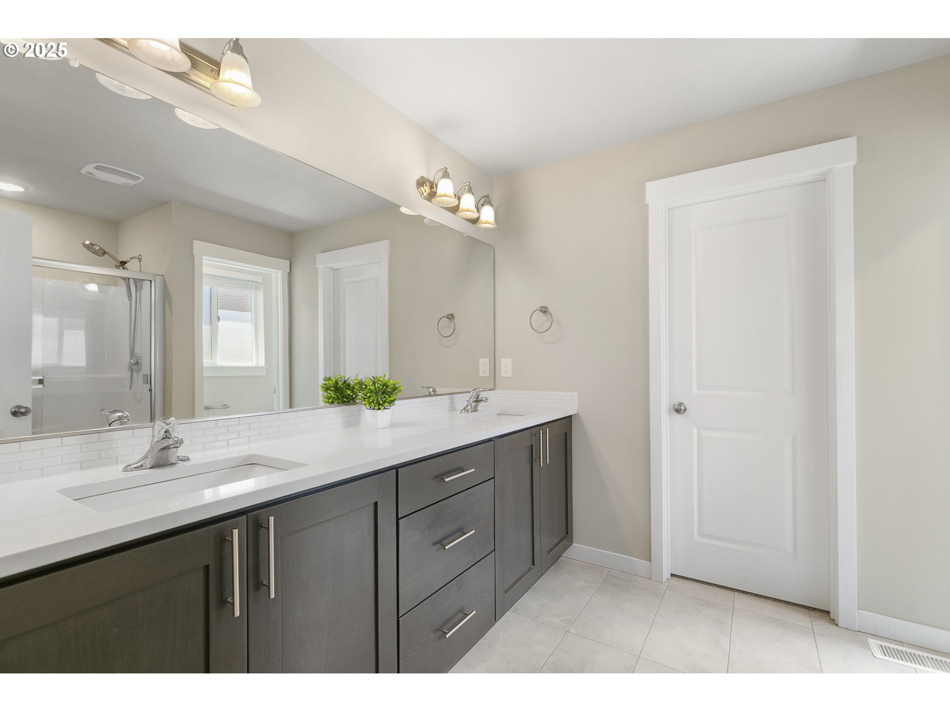 1815 Northeast 172nd Street Ridgefield, WA 98642 - Photo 8 of 19 a bathroom with a double vanity sink and a mirror