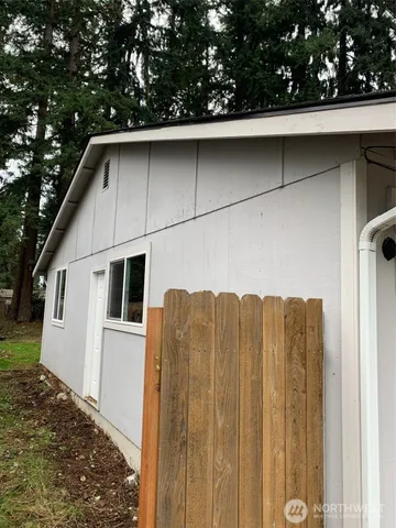 a back view of a house with backyard