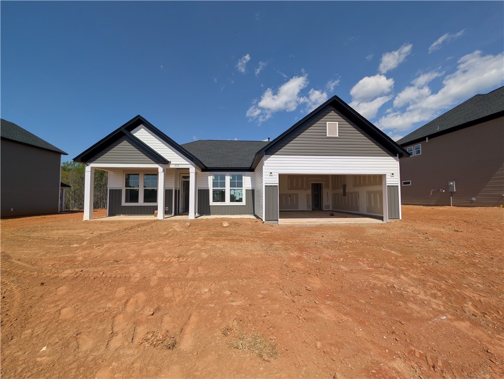 This new construction home boasts a modern facade, offering a blank canvas for your personal touches.