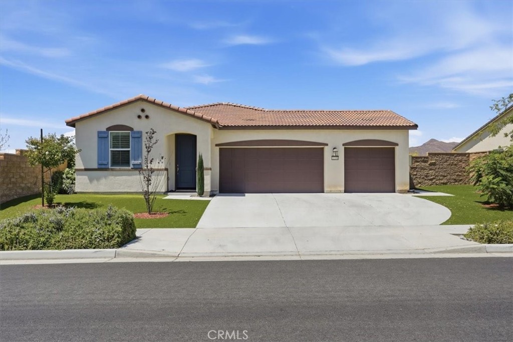32350 Iron Trail Road Winchester, CA 92596 - Photo 1 of 32 a front view of a house with garage and yard
