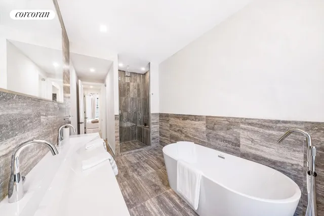 a bathroom with a bathtub and a sink