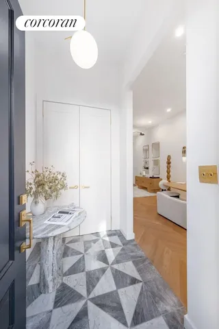 a view of front door of house with stairs