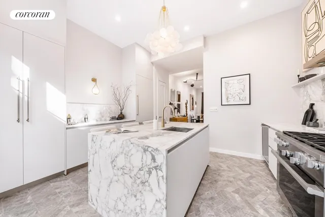 a kitchen with a sink and a large window