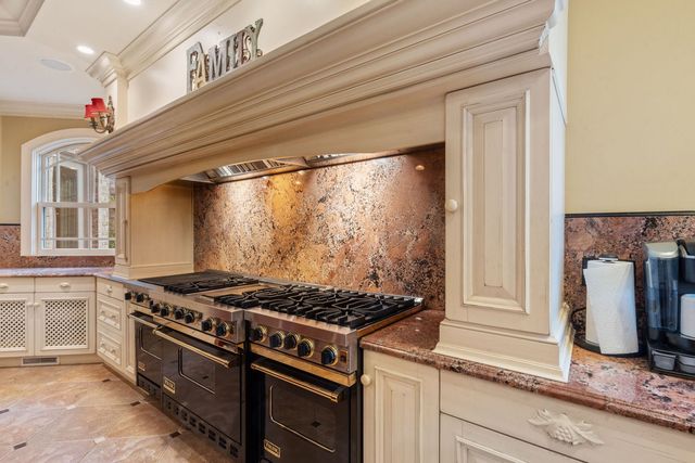 a living room with a couch and a fireplace