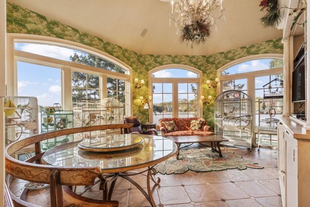 a view of an entryway with a floor to ceiling window