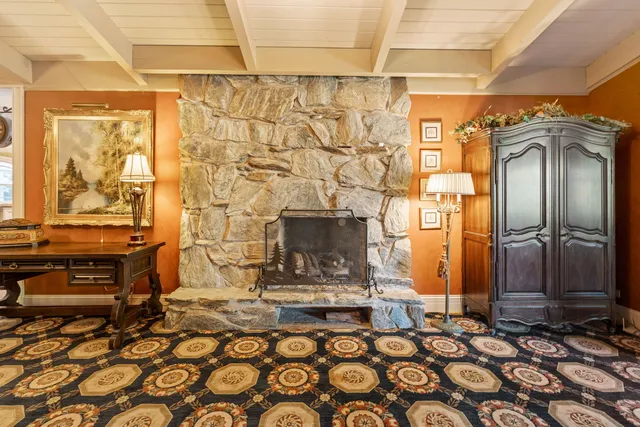 a bathroom with a double vanity sink mirror and shower