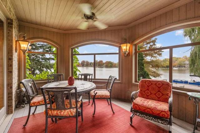a spacious bathroom with a granite countertop sink a mirror and shower