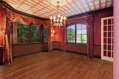 a spacious bedroom with a bed and a window