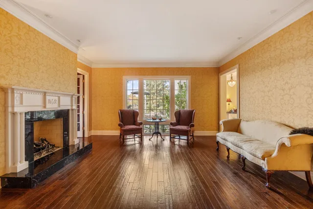 a bathroom with a granite countertop sink a mirror and shower