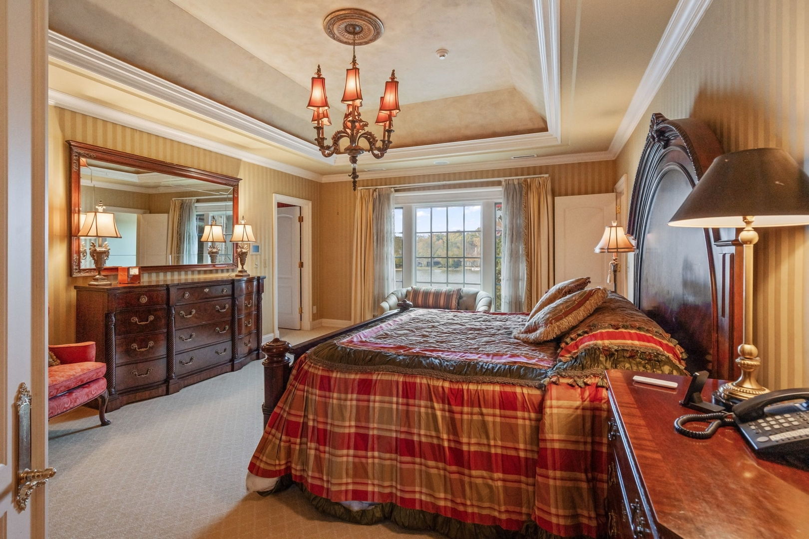 561 West 58th Street Hinsdale, IL 60521 - Photo 34 of 87 a bedroom with a bed and a chandelier