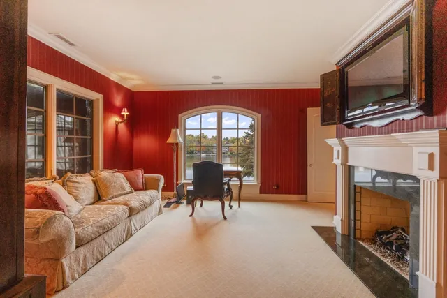 a room with lots of wooden furniture and painting on the wall
